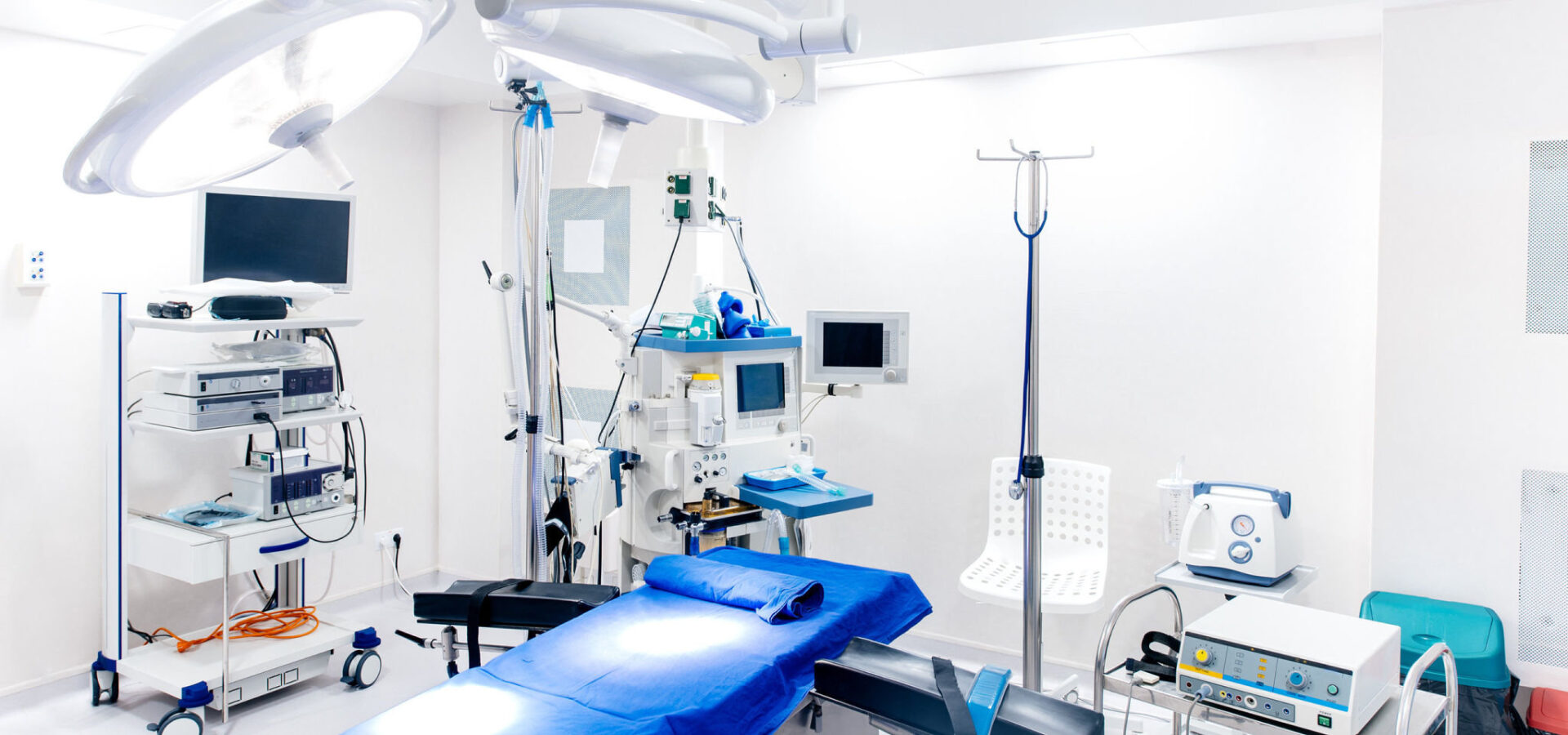 Medical devices and industrial lamps in surgery room of modern hospital. Interior hospital design concept
